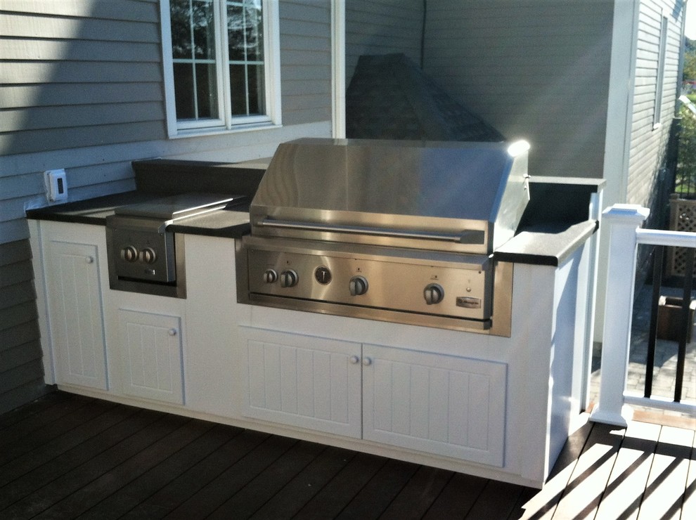 Inspiration for a large contemporary backyard outdoor kitchen deck remodel in Providence with no cover