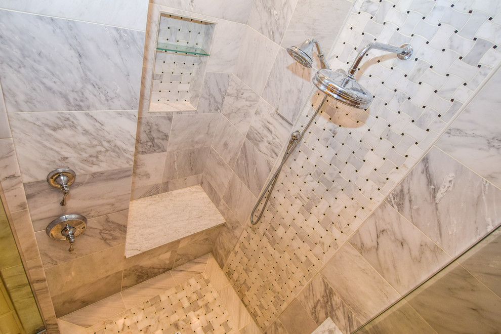 Design ideas for a mid-sized transitional master bathroom in Chicago with raised-panel cabinets, white cabinets, a drop-in tub, a corner shower, gray tile, white tile, stone tile, brown walls, a drop-in sink and marble benchtops.