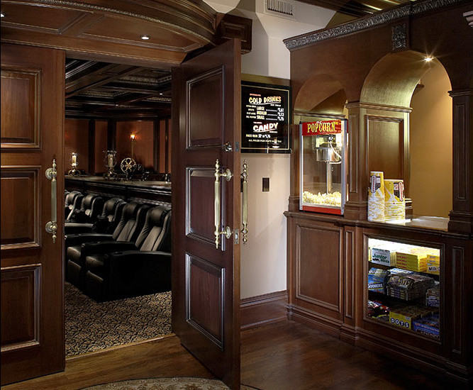 This is an example of a large traditional enclosed home theatre in New York with brown walls, carpet, a projector screen and brown floor.