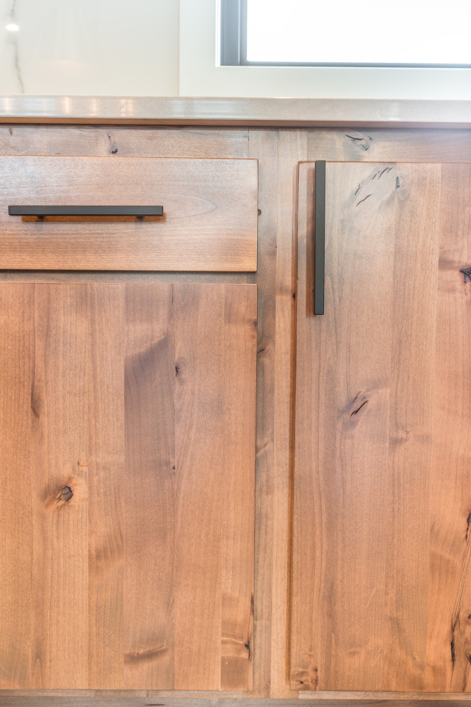 Mountain style u-shaped kitchen photo with shaker cabinets and an island