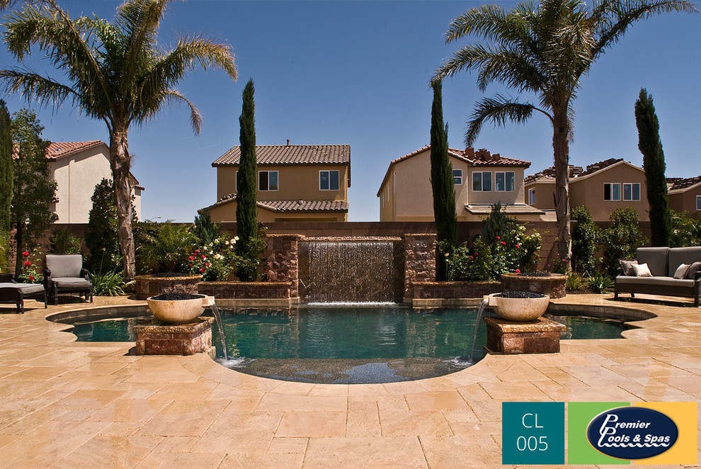 Inspiration for a mediterranean backyard custom-shaped pool in Austin with a water feature.