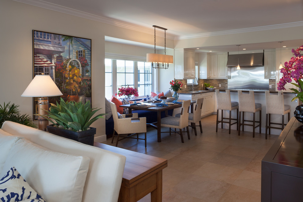 This is an example of a mid-sized tropical dining room in Miami.