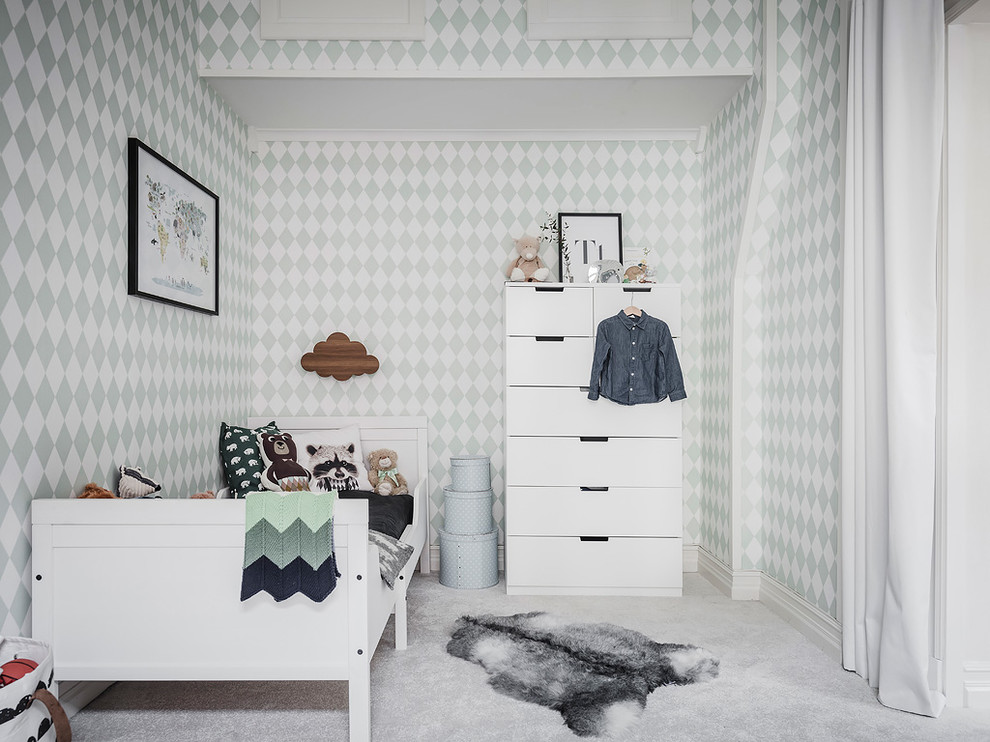 Scandinavian gender-neutral kids' bedroom in Gothenburg with green walls, carpet and grey floor.