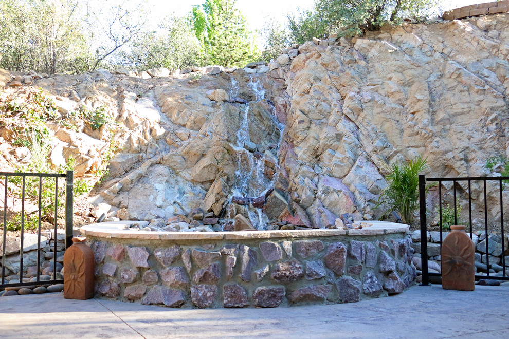 Design ideas for a large southwestern partial sun and drought-tolerant backyard concrete paver water fountain landscape in Phoenix.