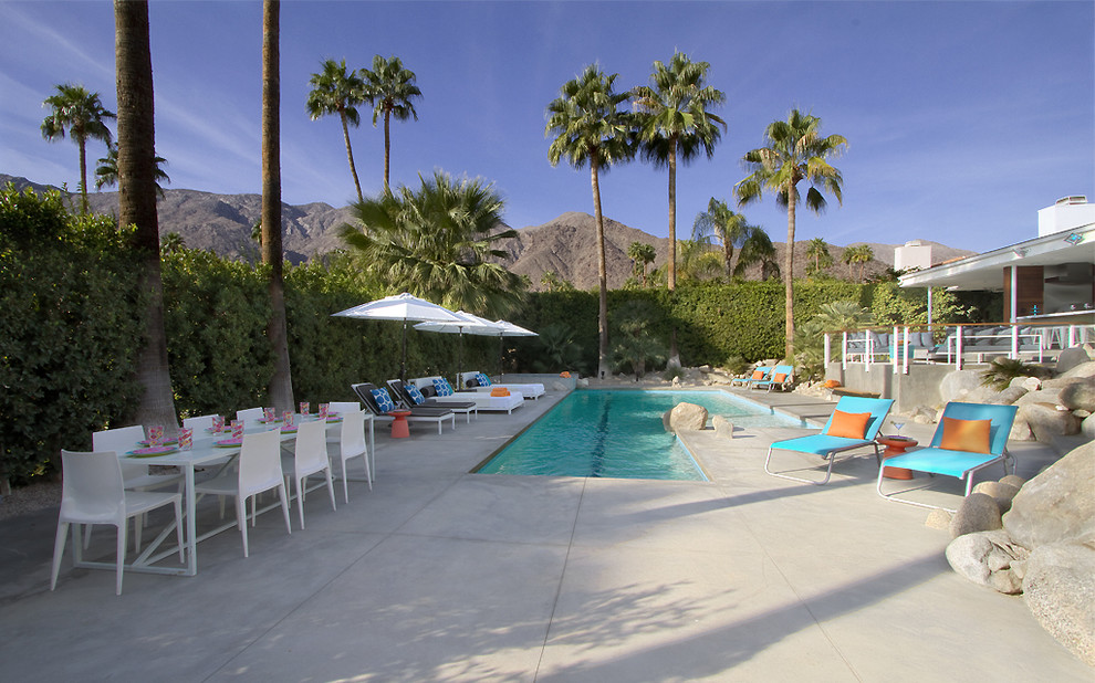 Photo of a midcentury custom-shaped pool in Other.
