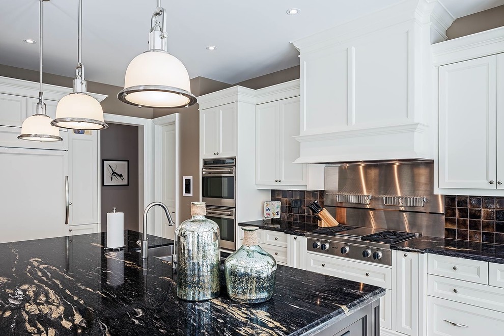 Large transitional galley kitchen pantry in Toronto with a double-bowl sink, recessed-panel cabinets, white cabinets, granite benchtops, brown splashback, stainless steel appliances, ceramic floors and with island.