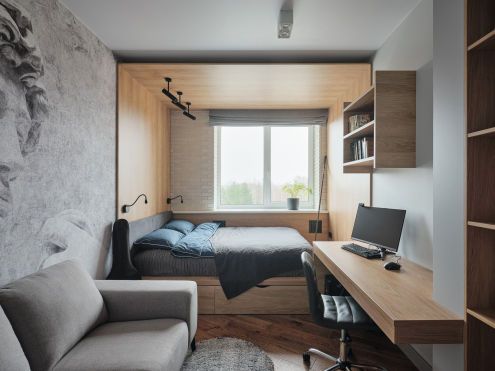 Inspiration for a contemporary teen’s room for boys in Saint Petersburg with grey walls, medium hardwood flooring and brown floors.