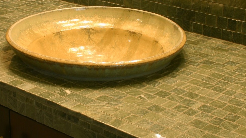 Inspiration for a rustic master green tile and ceramic tile bathroom remodel in Phoenix with green cabinets, an integrated sink and tile countertops