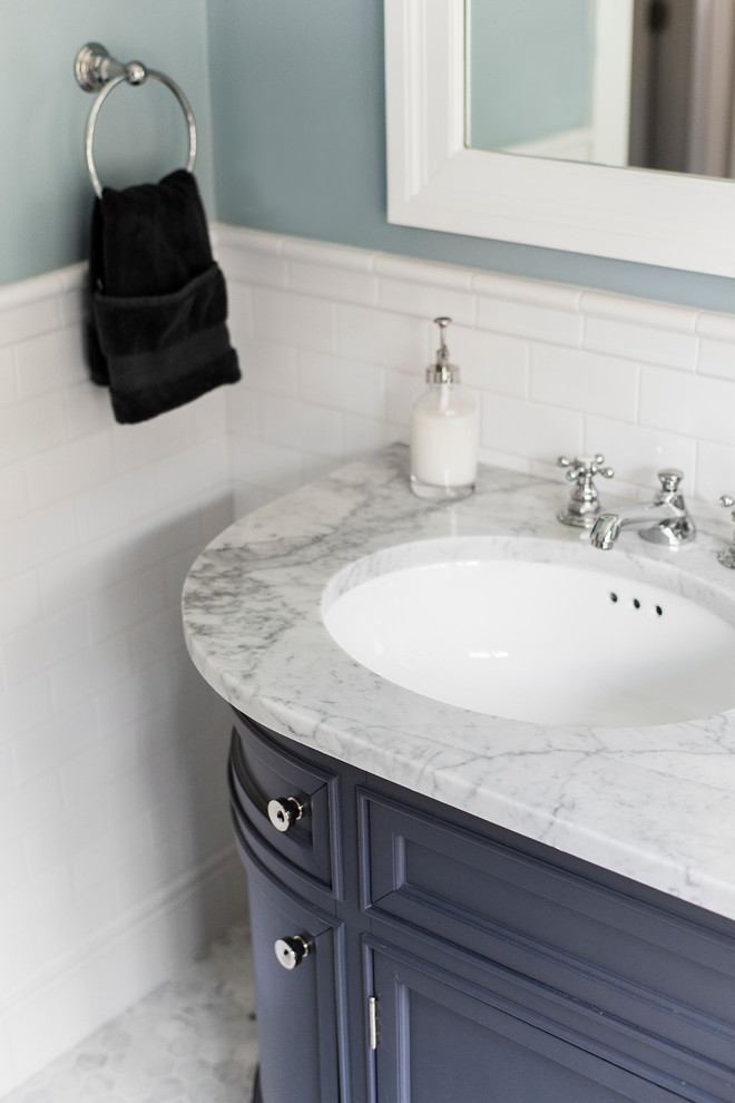 Inspiration for a mid-sized timeless master white tile and ceramic tile marble floor corner shower remodel in Boston with an undermount sink, recessed-panel cabinets, gray cabinets, marble countertops and blue walls