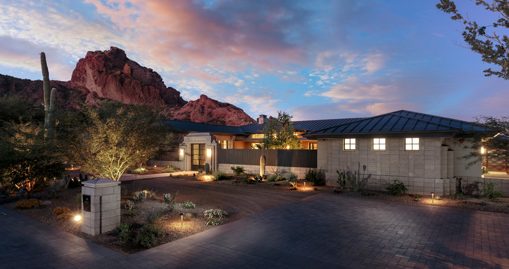 Design ideas for a contemporary front yard driveway in Phoenix with concrete pavers.