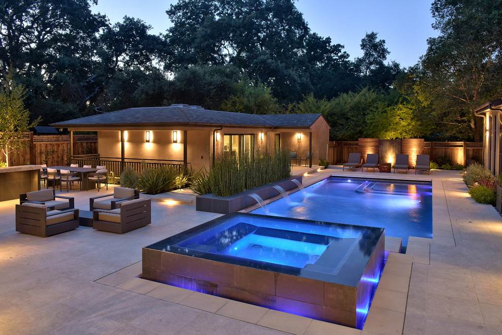 Inspiration for a large contemporary backyard patio in San Francisco with a fire feature, tile and no cover.