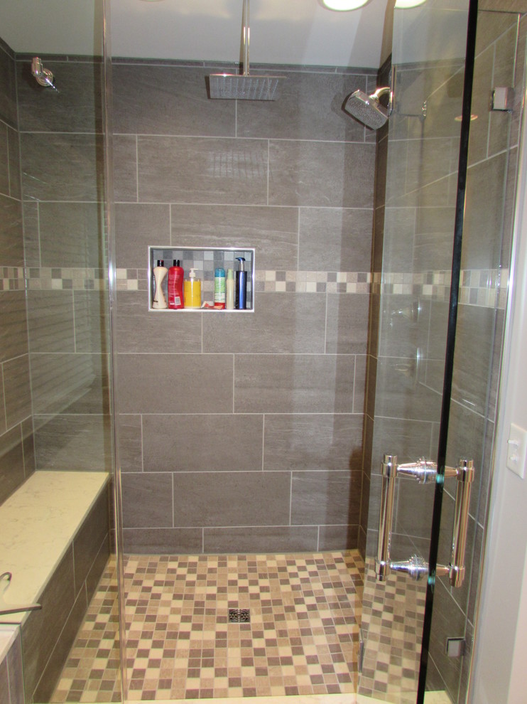 This is an example of a large transitional master bathroom in DC Metro with granite benchtops, an alcove shower, a two-piece toilet, multi-coloured tile, ceramic tile and ceramic floors.