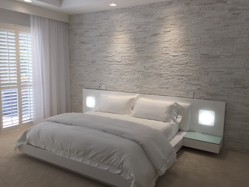 Mid-sized contemporary master bedroom in Miami with white walls, carpet and beige floor.
