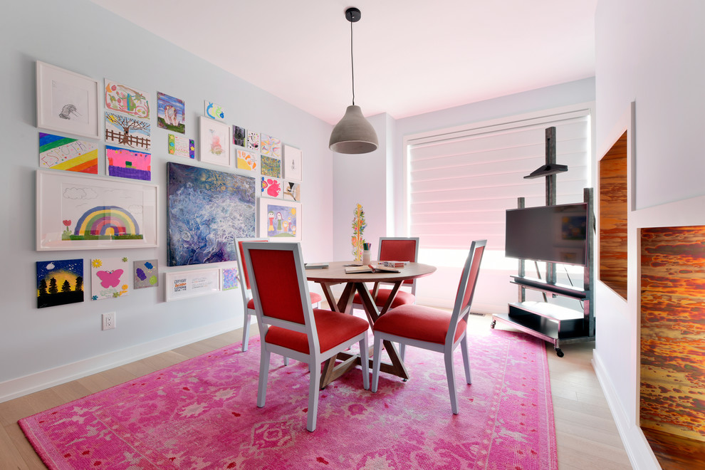 This is an example of a contemporary kids' study room for kids 4-10 years old in Ottawa with grey walls, light hardwood floors and beige floor.