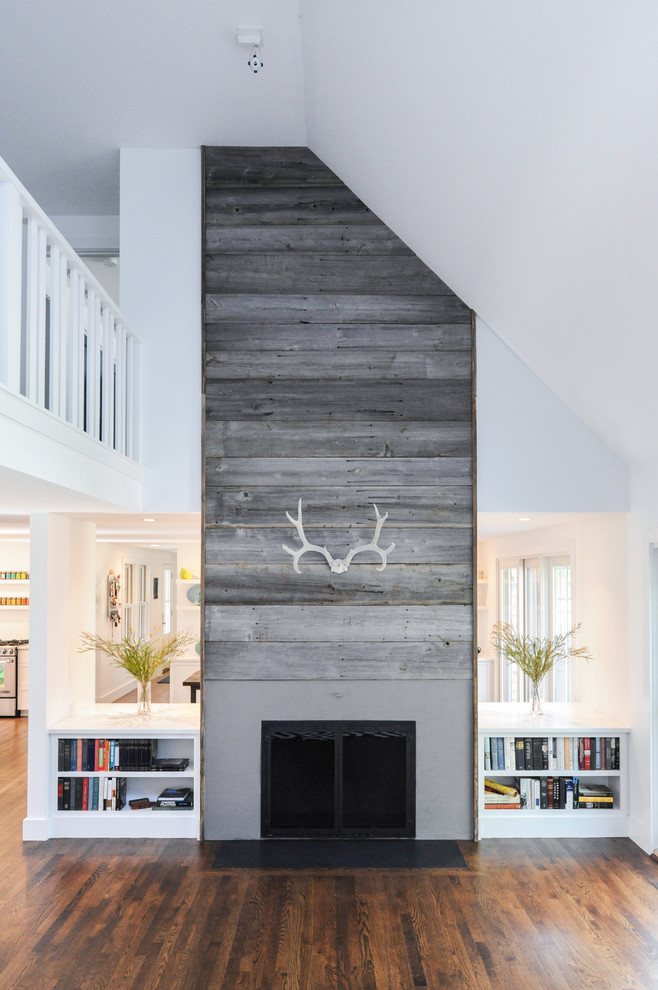 Inspiration for a mid-sized transitional open concept living room in Boston with white walls, dark hardwood floors, a standard fireplace and no tv.