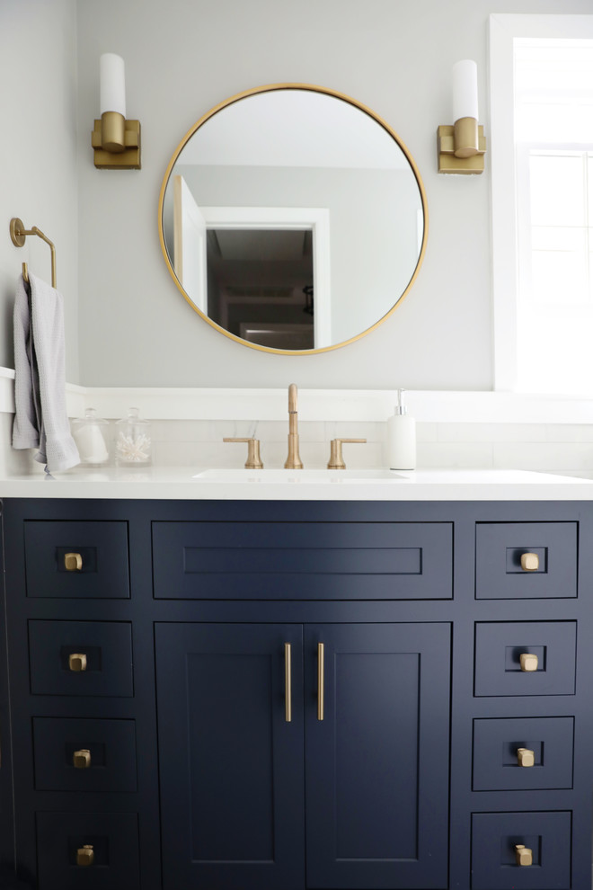 Inspiration for a mid-sized modern bathroom in New York with shaker cabinets, blue cabinets, grey walls, porcelain floors, with a sauna, engineered quartz benchtops, white benchtops and an undermount sink.