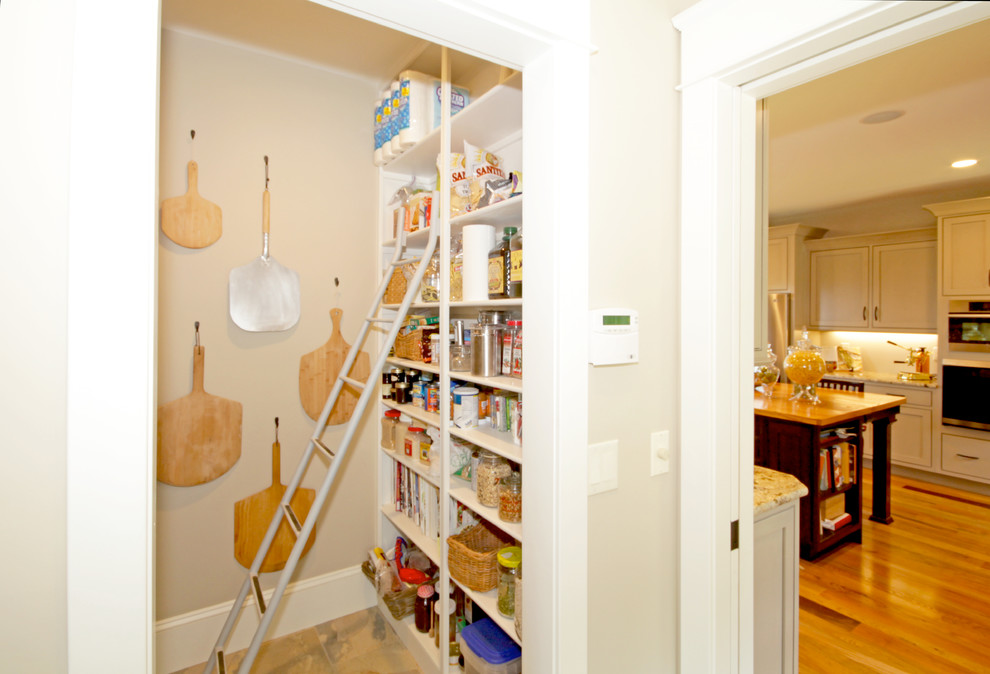 This is an example of a mid-sized transitional kitchen pantry in Richmond with medium hardwood floors.