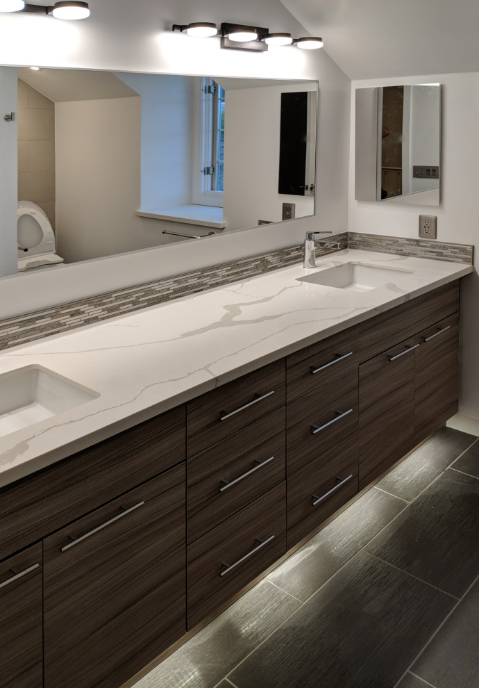 Inspiration for a large modern master bathroom in Seattle with flat-panel cabinets, brown cabinets, beige tile, porcelain tile, grey walls, porcelain floors, engineered quartz benchtops, black floor, white benchtops, a double vanity and a floating vanity.