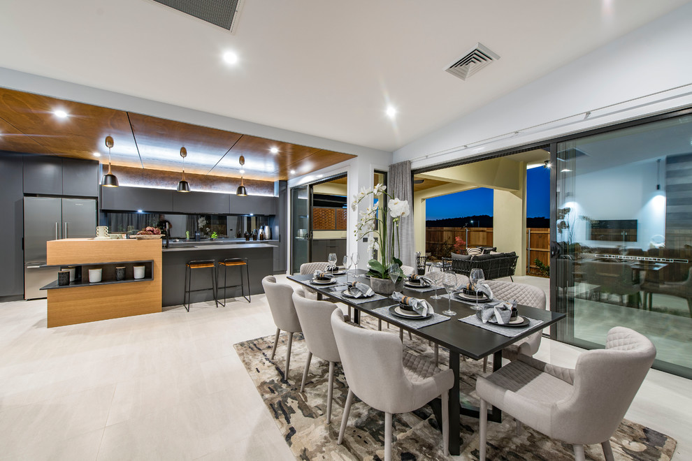 Contemporary open plan dining in Canberra - Queanbeyan with white walls and beige floor.