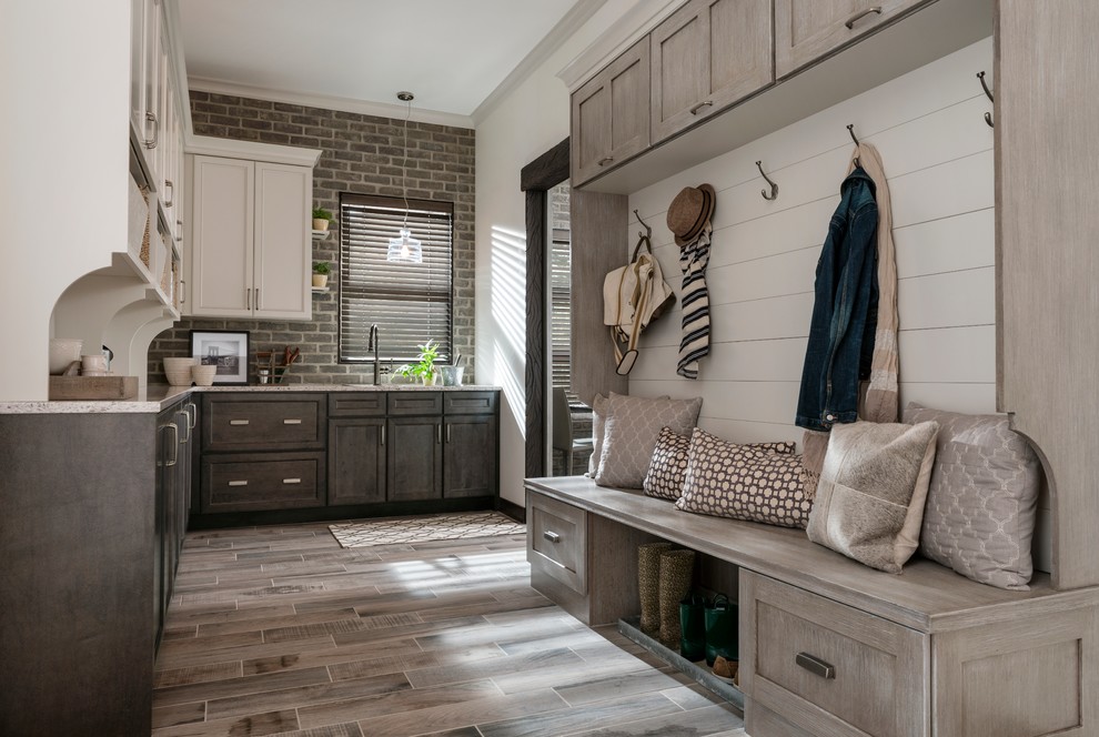 Inspiration for a mid-sized country l-shaped kitchen pantry in Minneapolis with shaker cabinets, dark wood cabinets, granite benchtops, brick splashback, porcelain floors and beige floor.