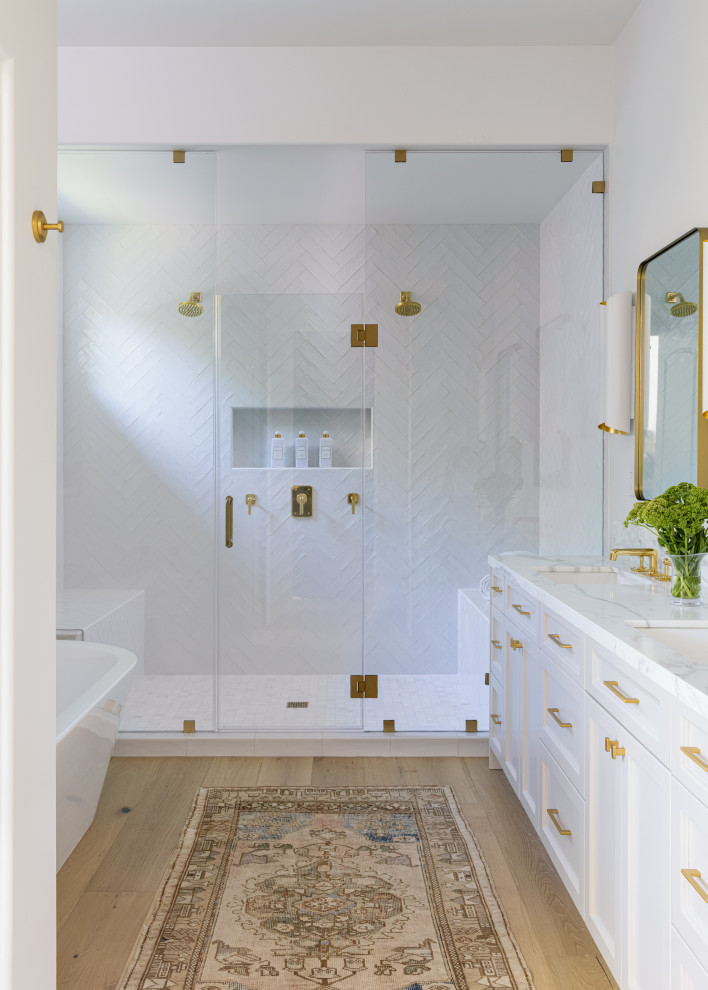 Design ideas for a mediterranean master bathroom in Other with recessed-panel cabinets, white cabinets, a double shower, white walls, marble benchtops, a hinged shower door, a shower seat, a double vanity and a built-in vanity.