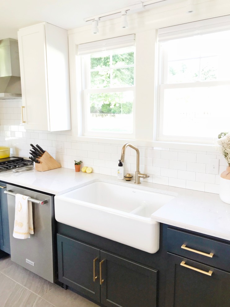 Inspiration for a transitional gray floor kitchen remodel with a farmhouse sink, quartz countertops and stainless steel appliances