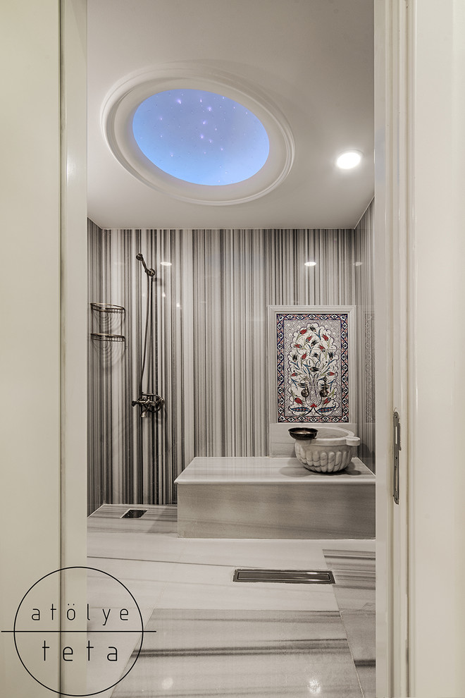 Photo of a mid-sized traditional bathroom in Other with a wall-mount toilet, gray tile, marble, grey walls, marble floors, with a sauna, a console sink, marble benchtops, grey floor and grey benchtops.