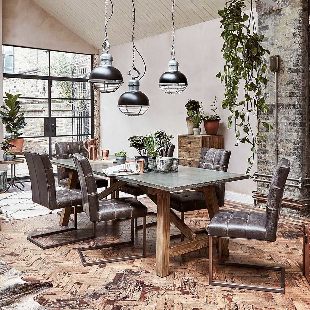 Inspiration for an industrial dining room in Other.