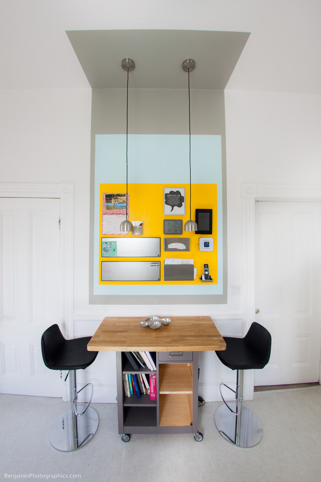 This is an example of a mid-sized contemporary separate dining room in San Francisco with multi-coloured walls and vinyl floors.