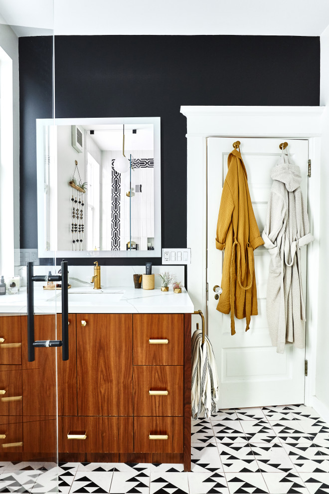 Photo of a medium sized eclectic bathroom in San Francisco with flat-panel cabinets, medium wood cabinets, a double shower, a two-piece toilet, black and white tiles, ceramic tiles, cement flooring, a submerged sink, engineered stone worktops, white floors, a hinged door, white worktops, a wall niche, a single sink and a freestanding vanity unit.