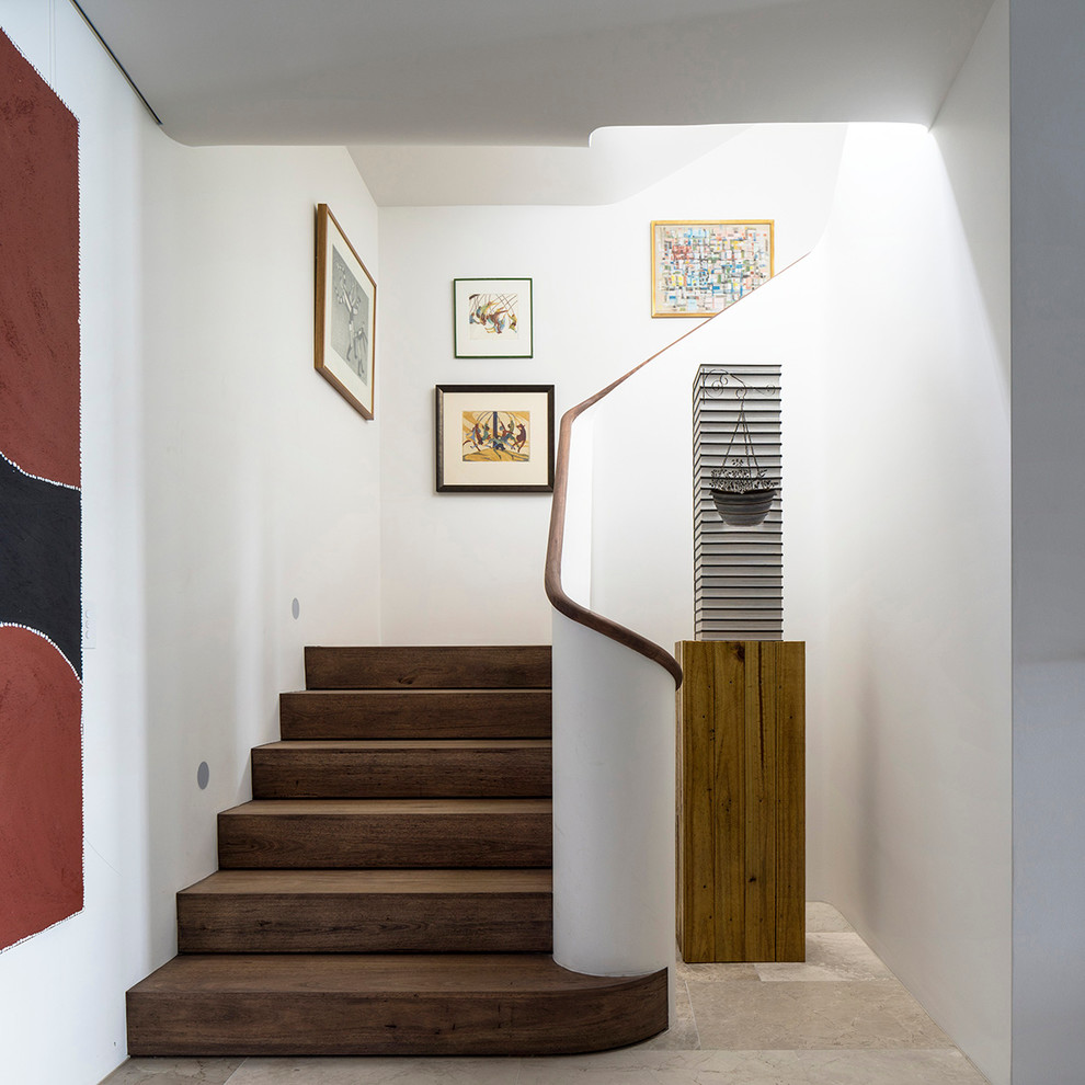 Inspiration for a contemporary wood l-shaped staircase in Sydney with wood risers.