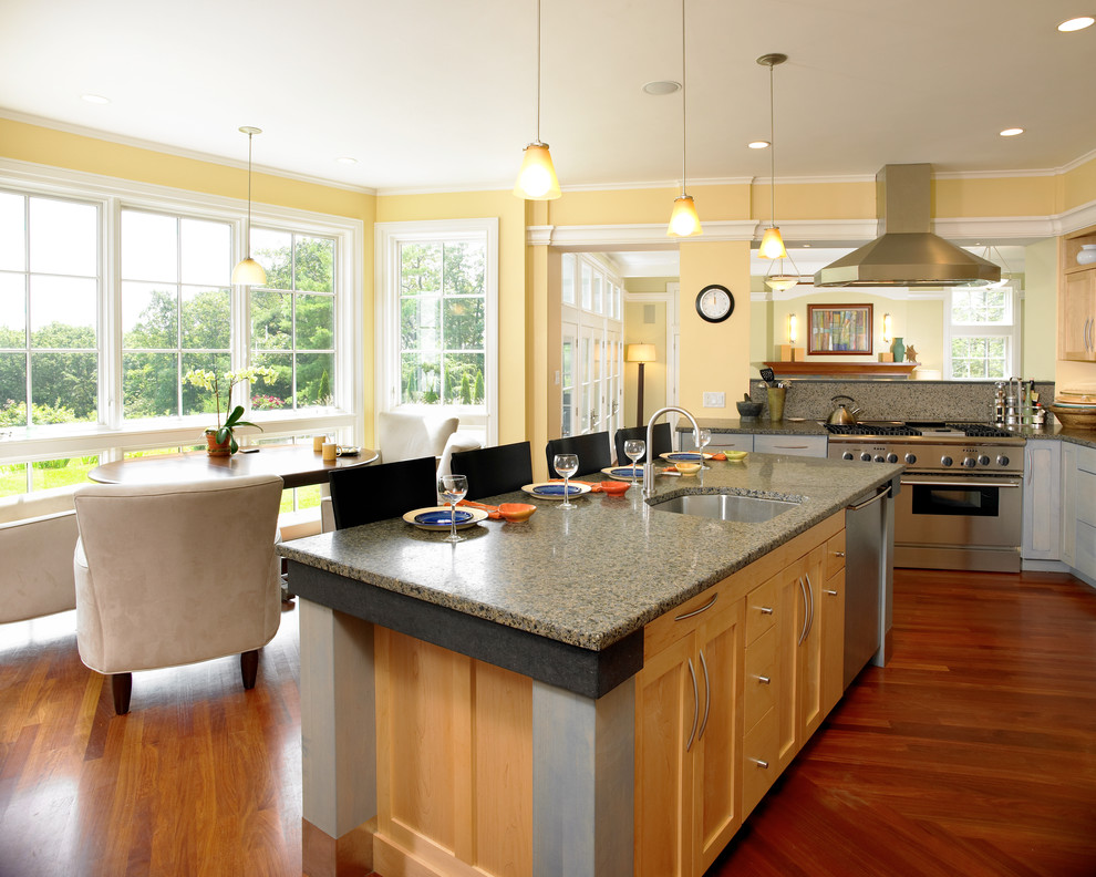 Design ideas for a large transitional l-shaped eat-in kitchen in Boston with recessed-panel cabinets, light wood cabinets, quartz benchtops, with island, an undermount sink, stainless steel appliances and dark hardwood floors.