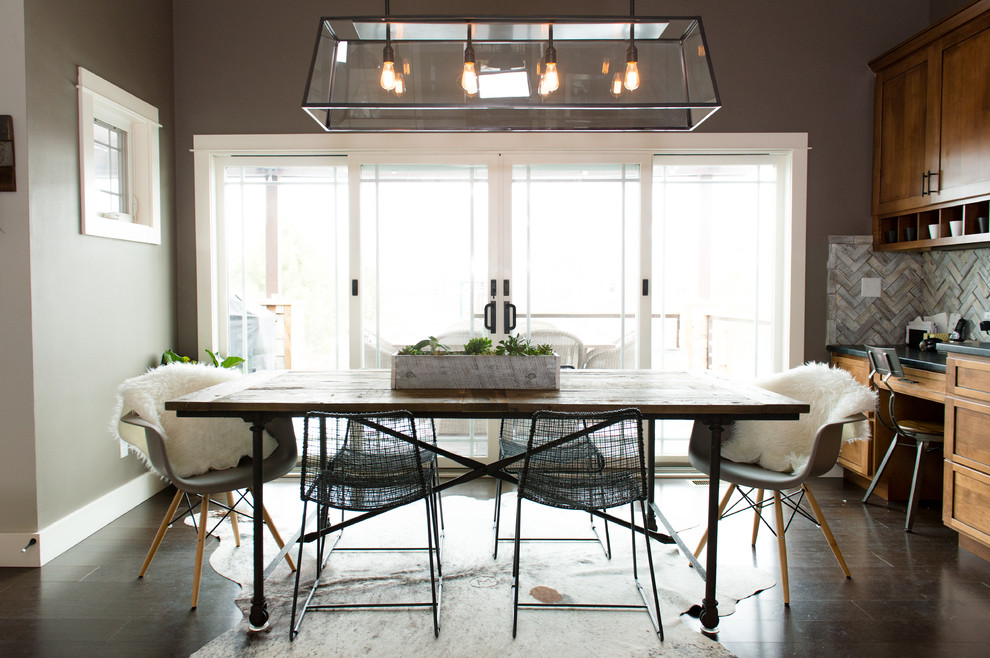 Photo of a contemporary dining room in San Francisco with dark hardwood floors.