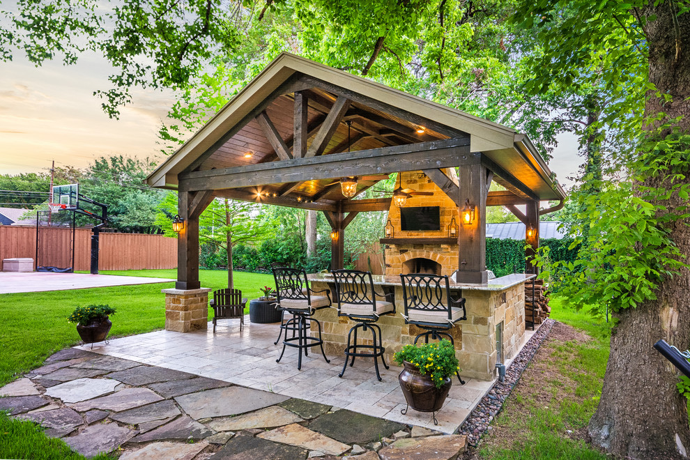 Photo of a mid-sized country backyard patio in Houston with tile and a gazebo/cabana.