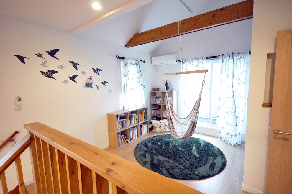 This is an example of a scandinavian family room in Tokyo Suburbs with white walls, no fireplace and no tv.