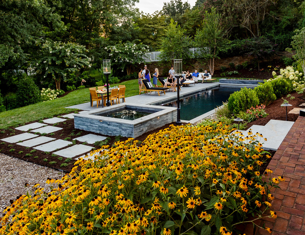 Inspiration for a backyard stone and rectangular hot tub remodel