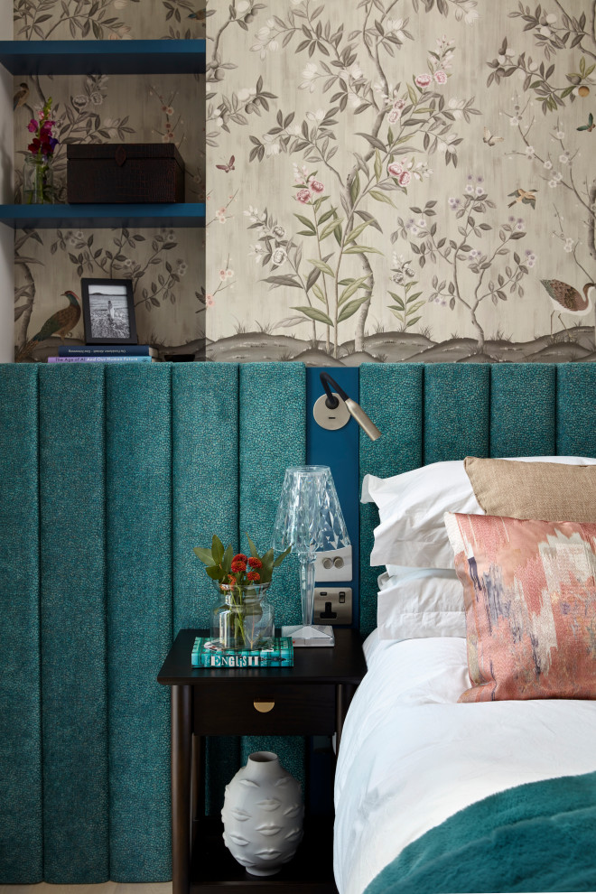 Mid-sized contemporary guest bedroom in London with wallpaper.