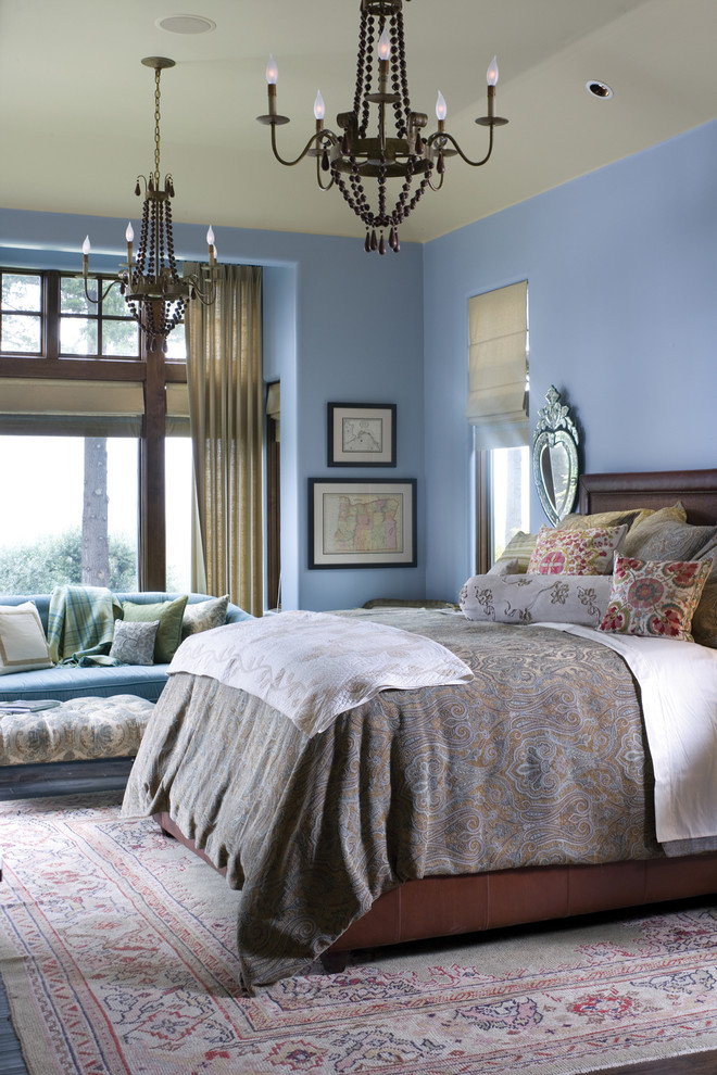 This is an example of a traditional bedroom in Portland with blue walls.