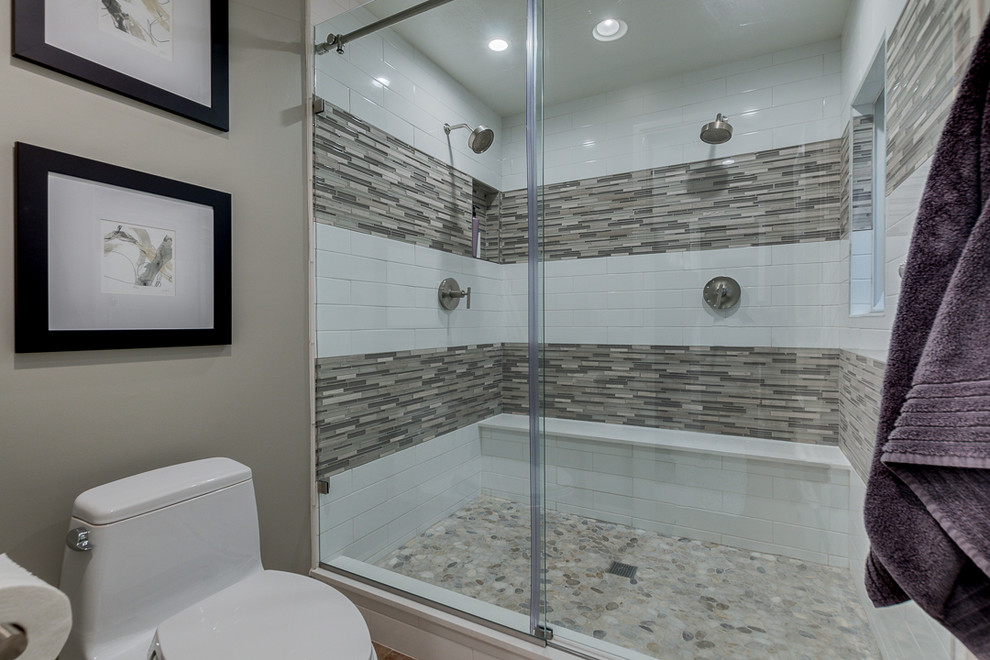 Small contemporary 3/4 bathroom in Phoenix with shaker cabinets, dark wood cabinets, a double shower, a one-piece toilet, white tile, porcelain tile, grey walls, travertine floors, an undermount sink, engineered quartz benchtops, beige floor, a sliding shower screen and white benchtops.