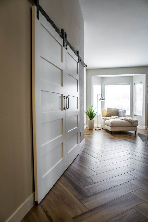 Inspiration for a mid-sized transitional light wood floor hallway remodel in Phoenix with beige walls