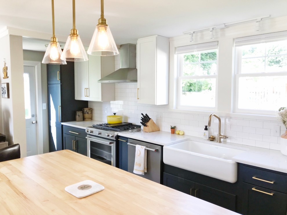 Inspiration for a transitional gray floor kitchen remodel with a farmhouse sink, quartz countertops and stainless steel appliances