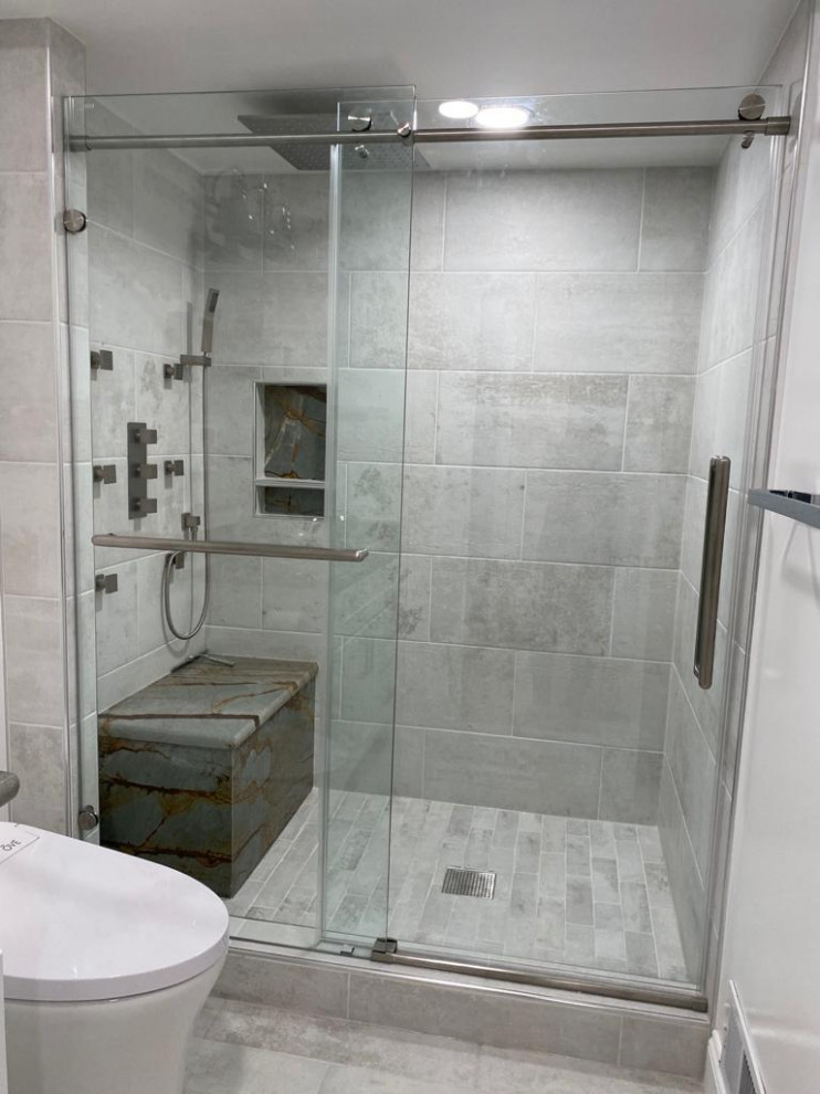 Photo of a mid-sized modern 3/4 bathroom in Other with white cabinets and a built-in vanity.