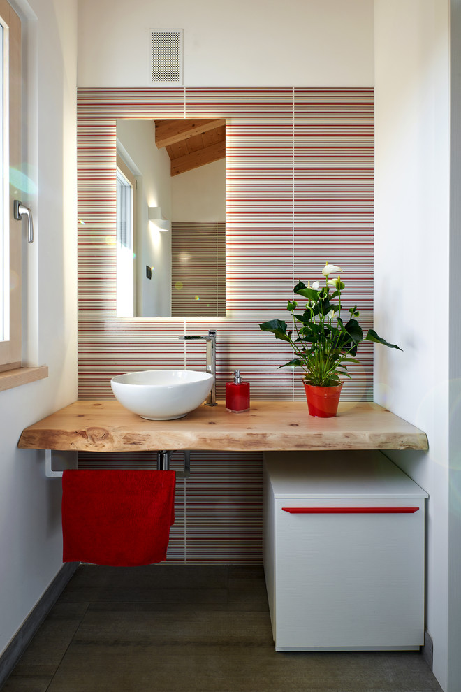 Inspiration for a small contemporary bathroom in Other with multi-coloured tile, white walls, a vessel sink, wood benchtops, beige benchtops, open cabinets, white cabinets, ceramic floors and grey floor.