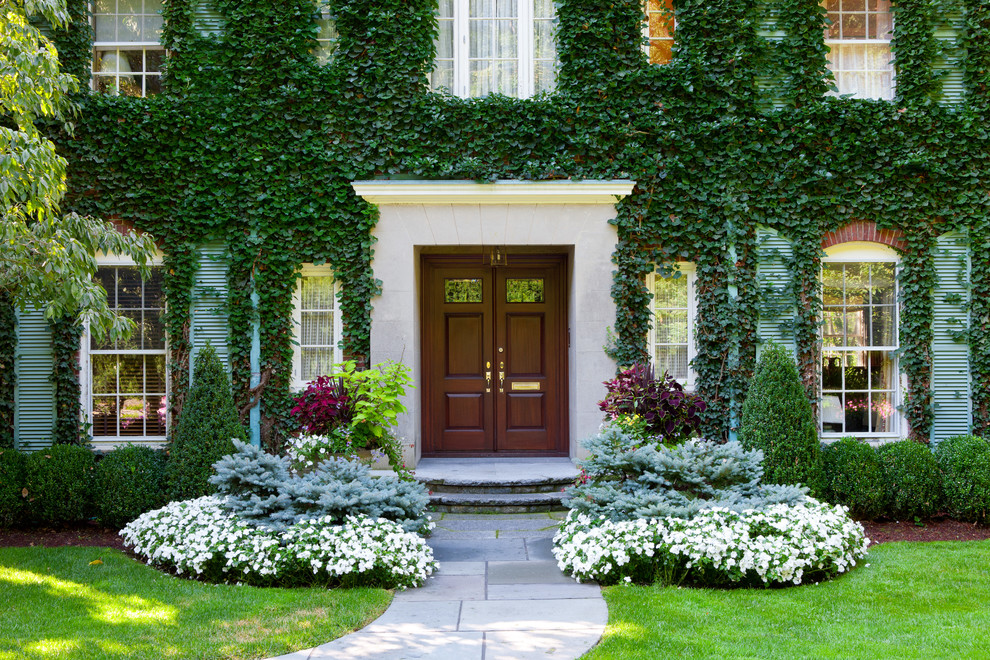 Inspiration for a large traditional front door in Boston with a double front door and a dark wood front door.