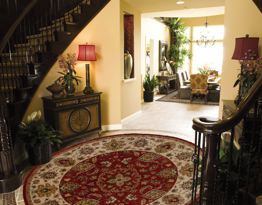 Inspiration for a large traditional foyer in Atlanta with porcelain floors and a double front door.