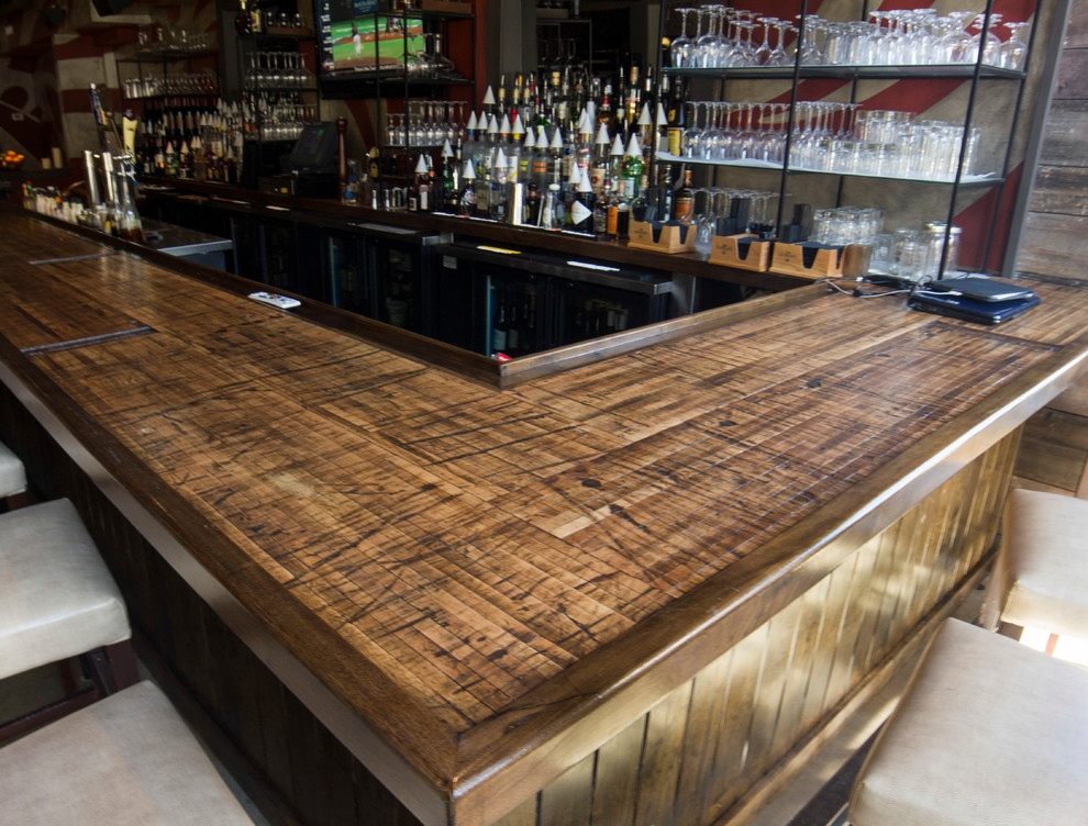 Inspiration for a rustic home bar remodel in Charleston