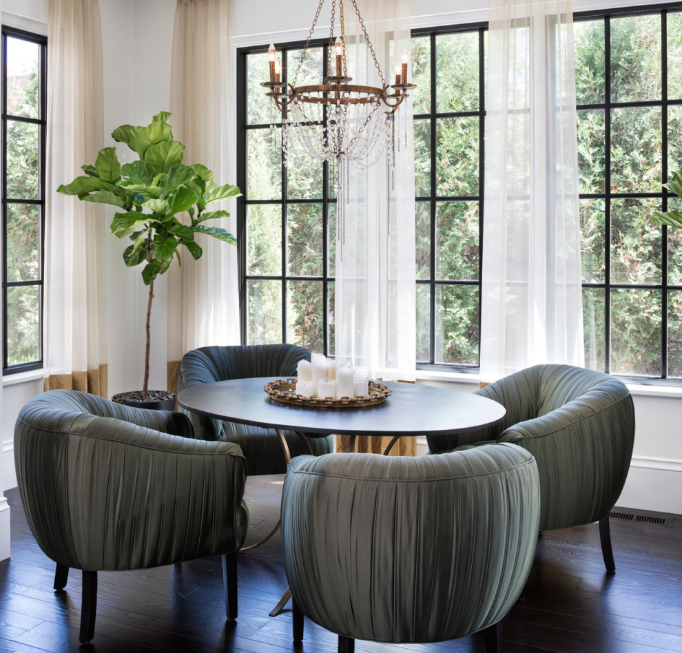 Photo of a mediterranean dining room in Minneapolis with white walls, dark hardwood floors and brown floor.