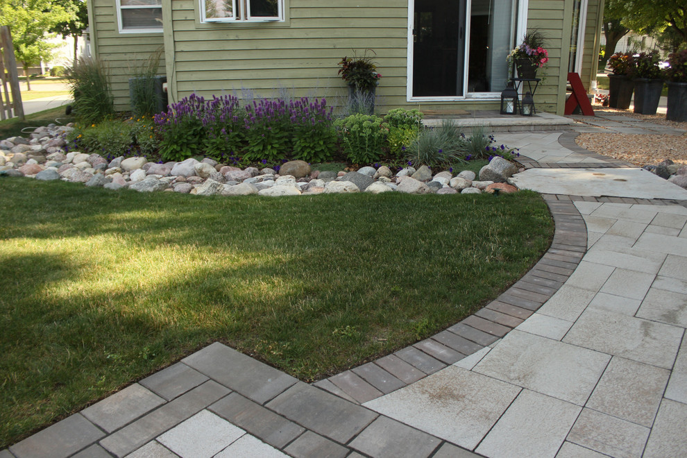 Inspiration for a mid-sized contemporary backyard patio in Milwaukee with gravel and no cover.