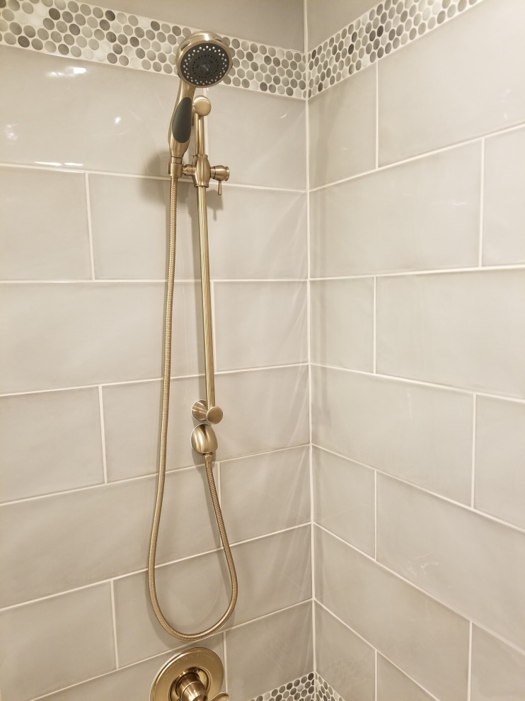 Inspiration for a transitional kids' gray tile and ceramic tile porcelain tile alcove bathtub remodel with beige walls