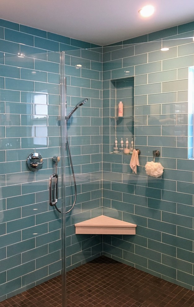 Design ideas for a mid-sized transitional master bathroom in San Francisco with recessed-panel cabinets, dark wood cabinets, a corner shower, blue tile, glass tile, white walls, porcelain floors, engineered quartz benchtops, brown floor and a sliding shower screen.